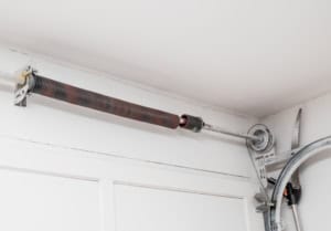 Broken garage door springs should only be repaired by a professional like Magic Overhead Door.
