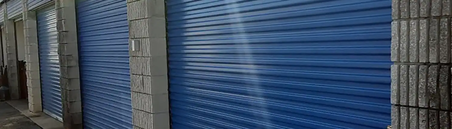 Commercial Rolling Steel Garage Doors – Daytona Beach, FL Blue rolling steel commercial garage doors installed by Magic Overhead Door in Daytona Beach, FL