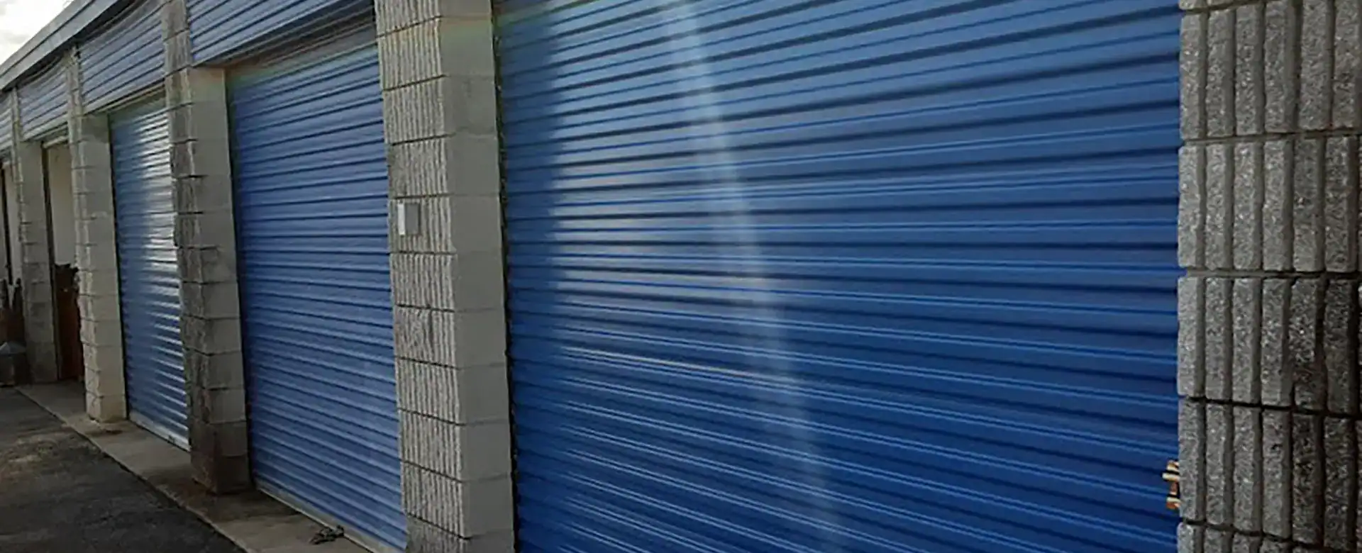 Commercial Rolling Steel Garage Doors – Daytona Beach, FL Blue rolling steel commercial garage doors installed by Magic Overhead Door in Daytona Beach, FL